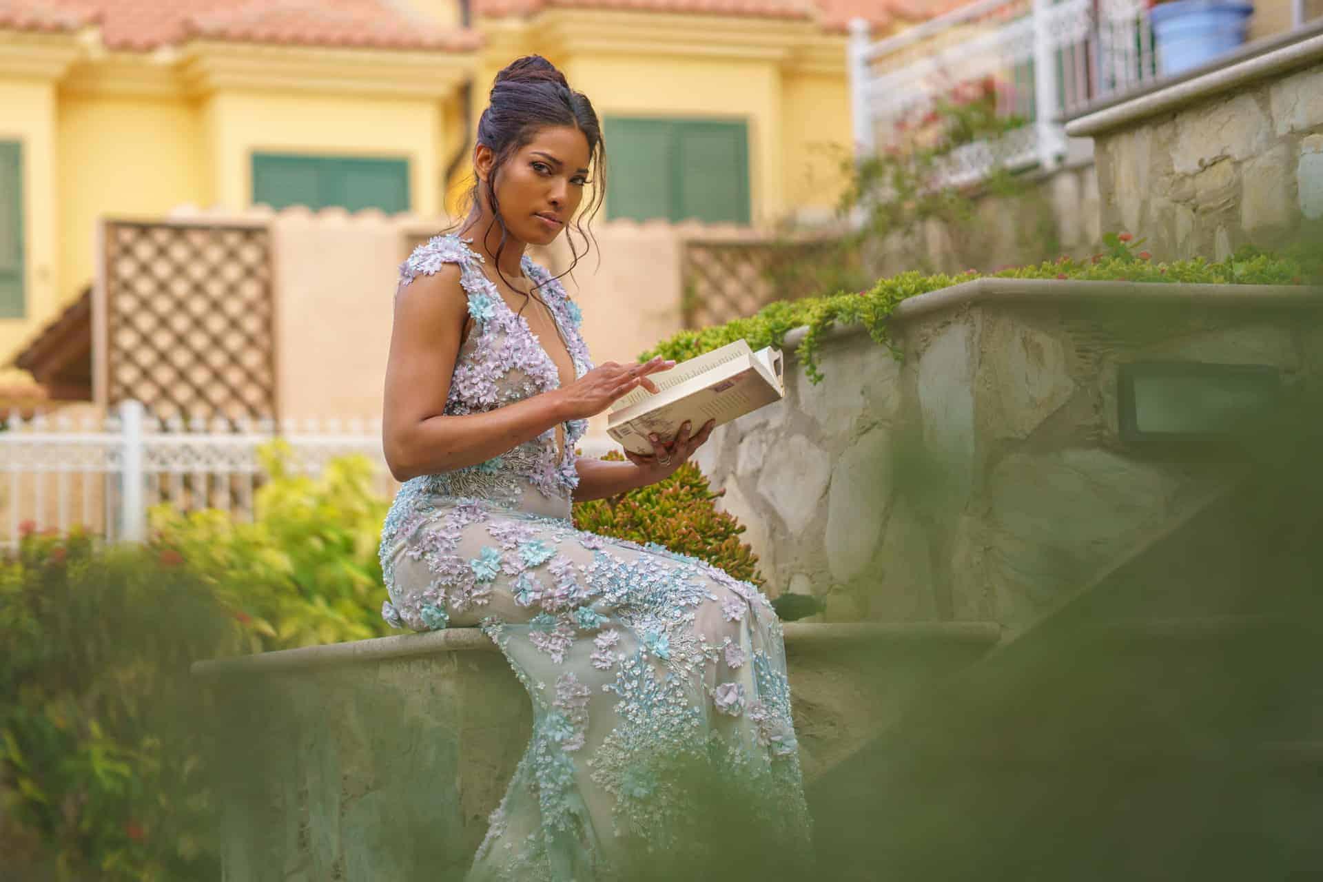 professional photo of model reading in garden